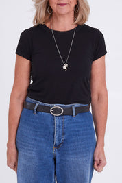 Model Sandy wearing size S of the Bronte Park Leather Belt in colour Black (Black), from the front, cropped image