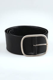A model wearing size S of the Emma Wide Leather Belt in colour Black (Black), from the front, showing the whole outfit