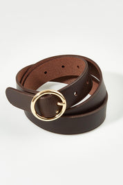 A model wearing size S of the Leah Leather Belt in colour Chocolate, from the front, showing the whole outfit