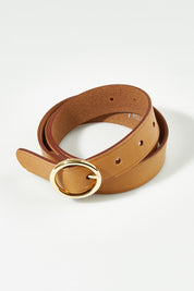 A model wearing size S of the Leah Leather Belt in colour Natural, from the front, showing the whole outfit