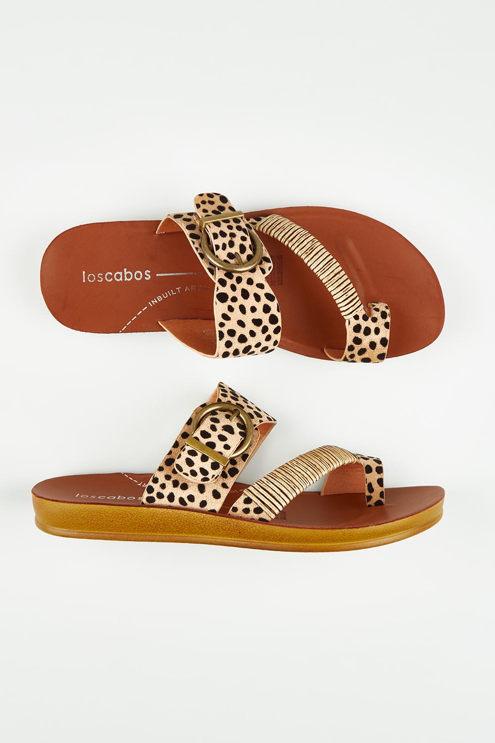 A model wearing size 37 of the Bria Flat Sandal in colour Cheetah, from the front, showing the whole outfit