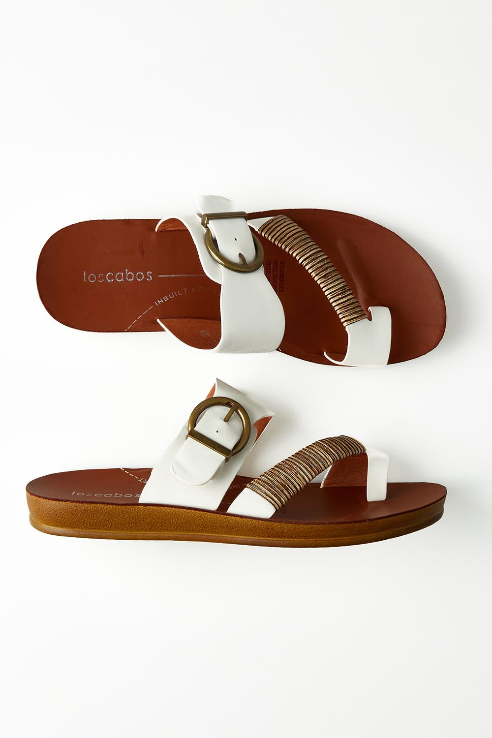 A model wearing size 37 of the Bria Flat Sandal in colour Offwhite (White), from the front, showing the whole outfit