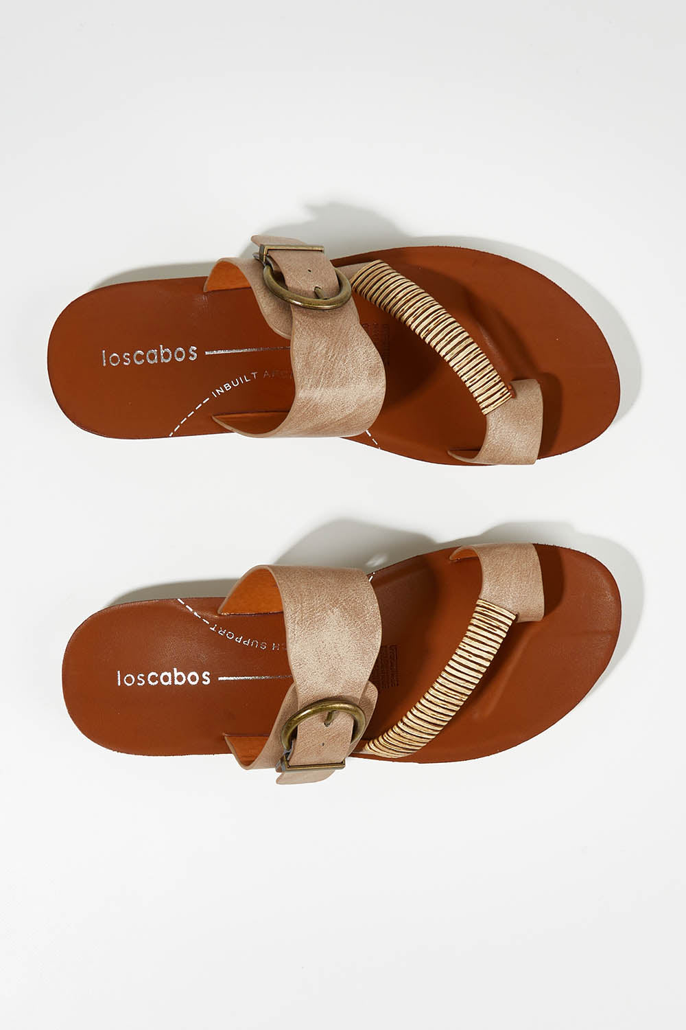 A model wearing size 37 of the Bria Flat Sandal in colour Taupe, from the front, showing the whole outfit
