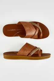 A model wearing size 37 of the Bride Slide in colour Chocolate, from the front, showing the whole outfit