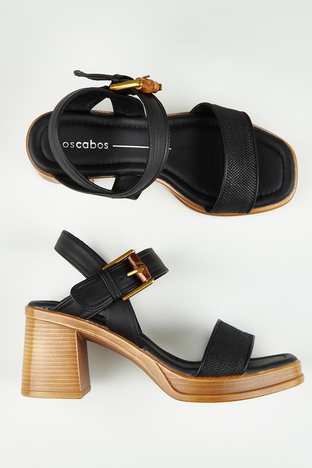 A model wearing size 37 of the Burgos Heel in colour Black (Black), from the front, showing the whole outfit