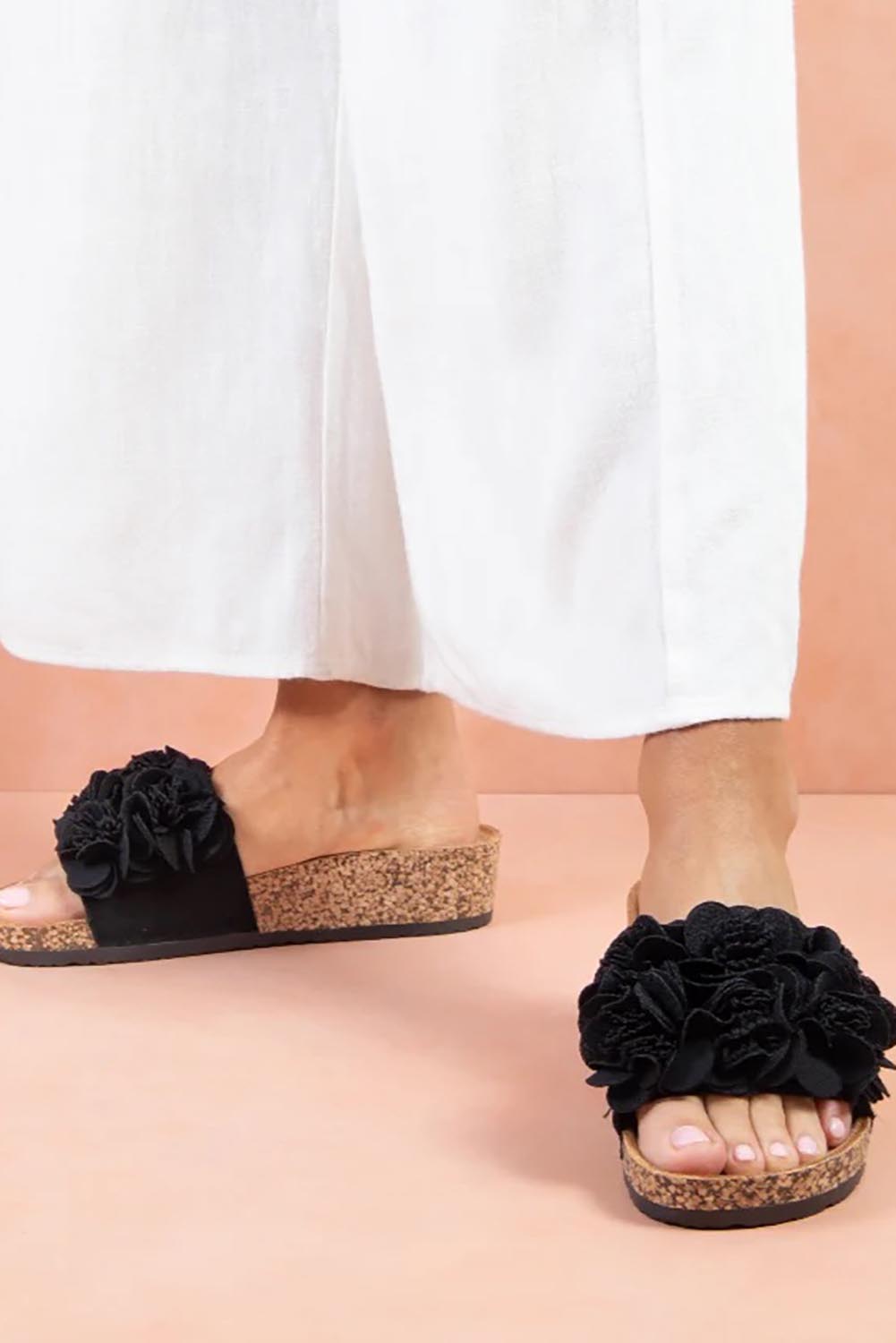Product shot of the Corsage Slide - Black in colour Black, from the front