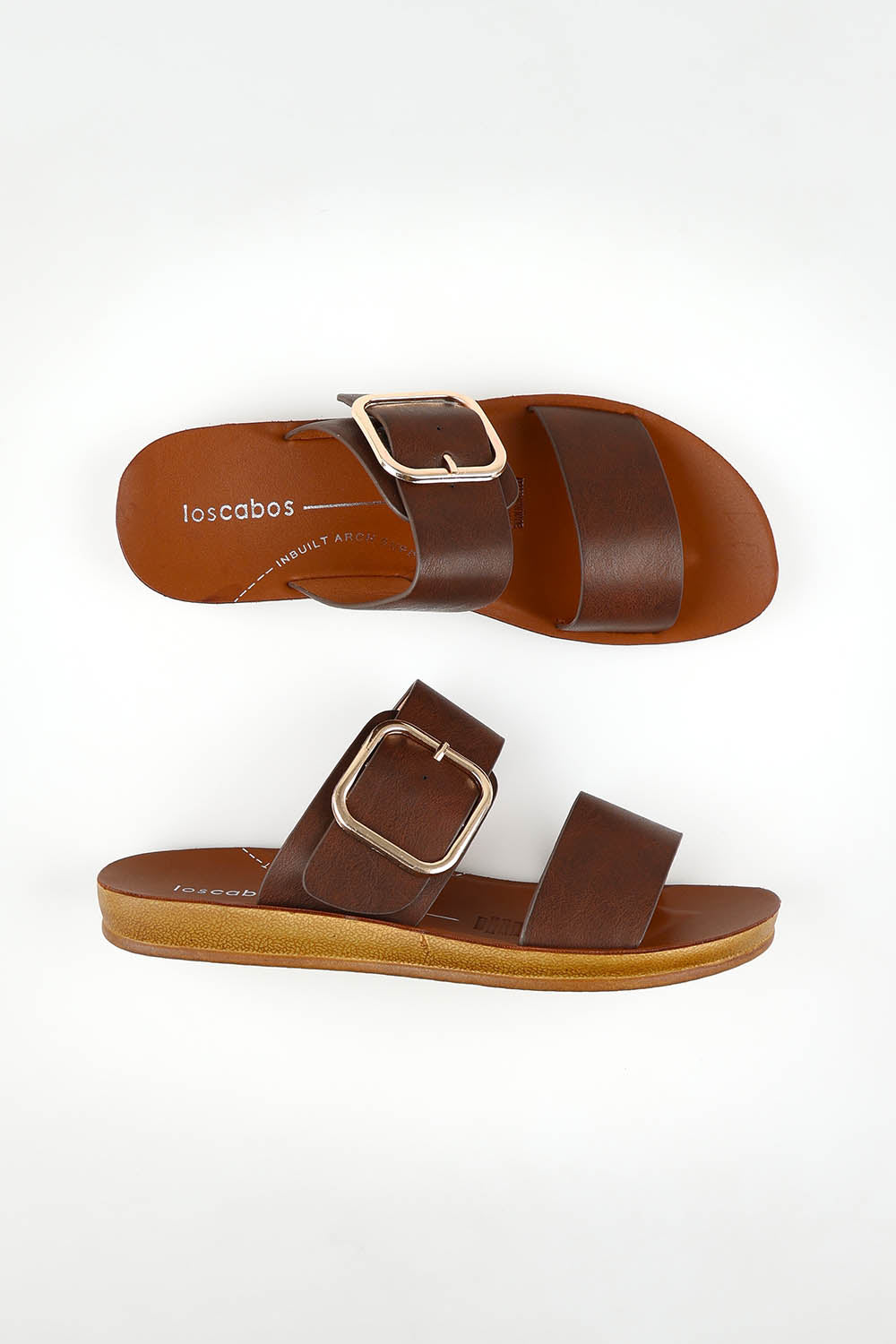 A model wearing size 37 of the Doti Double Strap Slide in colour Mocha, from the front, showing the whole outfit