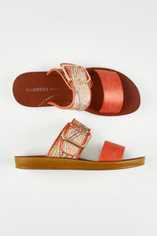 A model wearing size 37 of the Doti Double Strap Slide in colour Tangemulti, from the front, showing the whole outfit