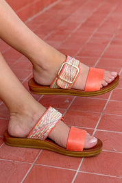 A model wearing the Doti Double Strap Slide in colour Tangemulti, from the front, showing the whole outfit