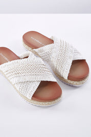 A model wearing size 36 of the Tinny Flat Sandal in colour White (White), from the front, showing the whole outfit