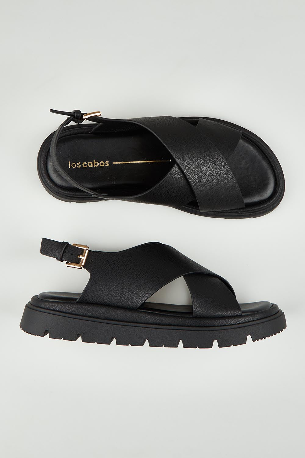 A model wearing size 37 of the Tolis Flatform Sandal in colour Black (Black), from the front, showing the whole outfit