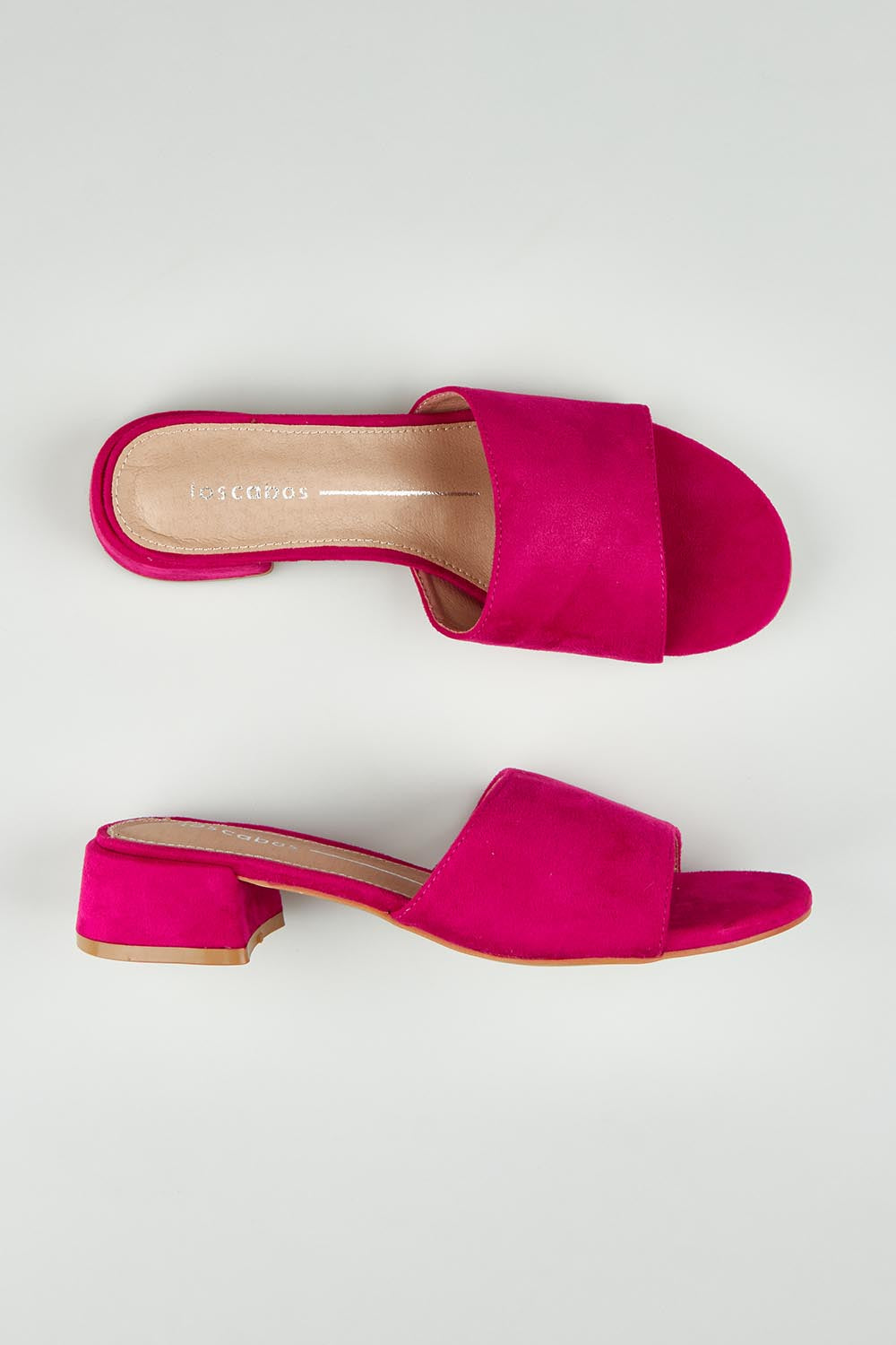 A model wearing size 37 of the Zayne Slip On Heel in colour Fushia (Pink), from the front, showing the whole outfit