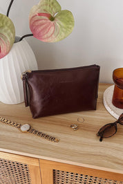 A model wearing The Everyday Pouch in colour Burgundy (Red), from the front, showing the whole outfit