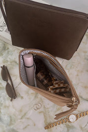 A model wearing The Everyday Pouch in colour Chocsuede, from the front, showing the whole outfit