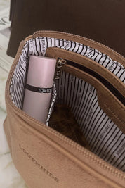 A model wearing The Everyday Pouch in colour Honeysuede, from the front, showing the whole outfit