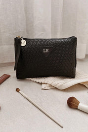 A model wearing the Carlo Pouch in colour Black (Black), from the front, showing the whole outfit