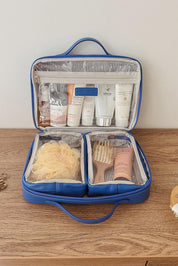 A model wearing the Georgie Toiletries Bag in colour OceanBlue (Blue), from the front, showing the whole outfit