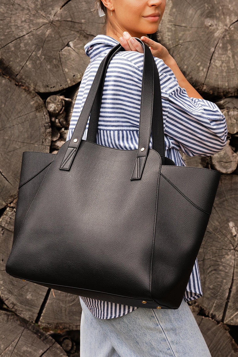 A model wearing the Parisian Shopper Bag in colour Black (Black), from the front, showing the whole outfit