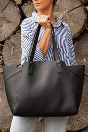 A model wearing the Parisian Shopper Bag in colour Black (Black), from the front, showing the whole outfit
