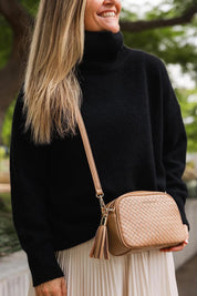 A model wearing the Jacinta Woven Crossbody Bag in colour Camelwoven, from the front, showing the whole outfit