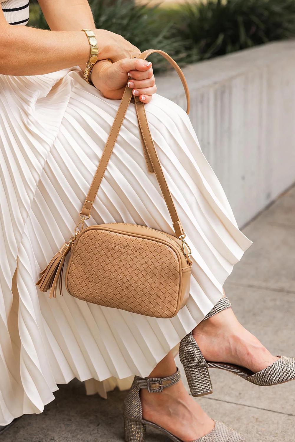 A model wearing the Jacinta Woven Crossbody Bag in colour Camelwoven, from the front, showing the whole outfit