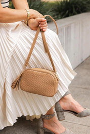A model wearing the Jacinta Woven Crossbody Bag in colour Camelwoven, from the front, showing the whole outfit