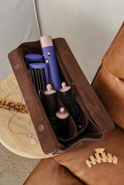 A model wearing the Margot Hot Tool Case in colour Chocolate, from the front, showing the whole outfit