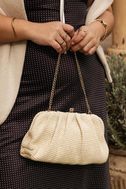 Product shot of the Goldie Clutch - Raffiavanilla in colour Raffiavanilla, from the back