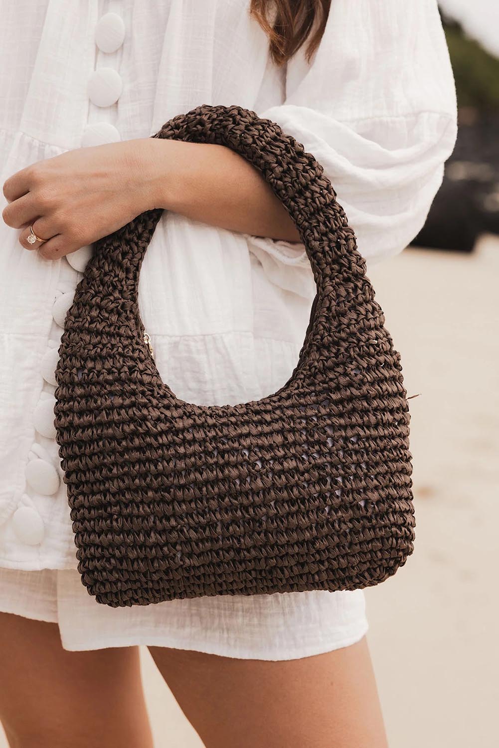 A model wearing the Nellie Woven Handbag in colour Chocolate, from the front, showing the whole outfit