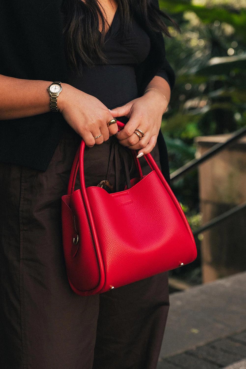 Product shot of the Steffie Mini Tote Bag - Red in colour Red, from the back