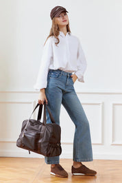 Model Genericm wearing size sample of the Jenn Nylon Travel Bag - Chocolate in colour Chocolate, from the front