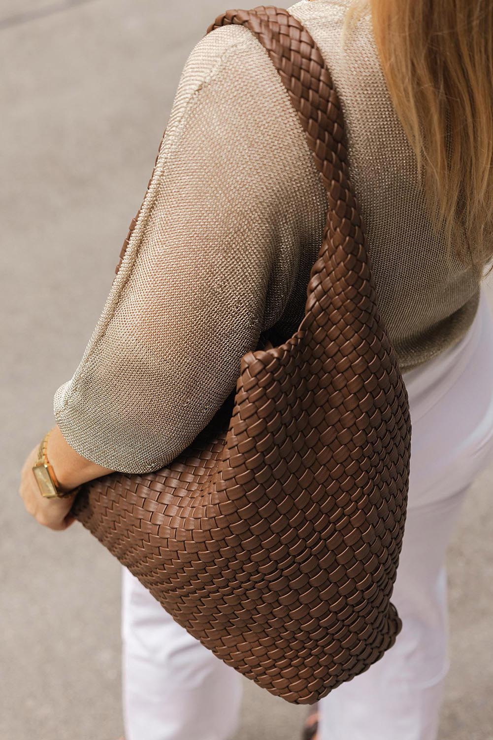 A model wearing the Gabby Woven Shoulder Bag in colour Chocolate, from the front, showing the whole outfit