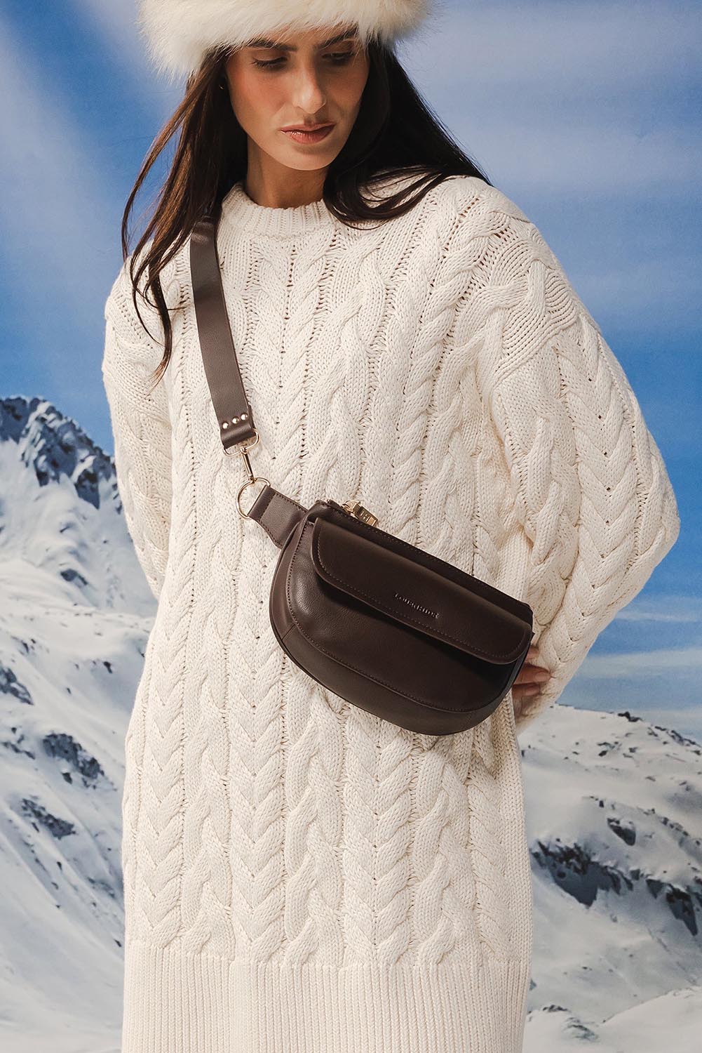Model Genericm wearing size sample of the Lola Belt Bag - Chocolate in colour Chocolate, from an angle