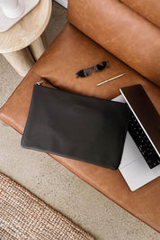 A model wearing the Liv Laptop Sleeve in colour Black (Black), from the front, showing the whole outfit