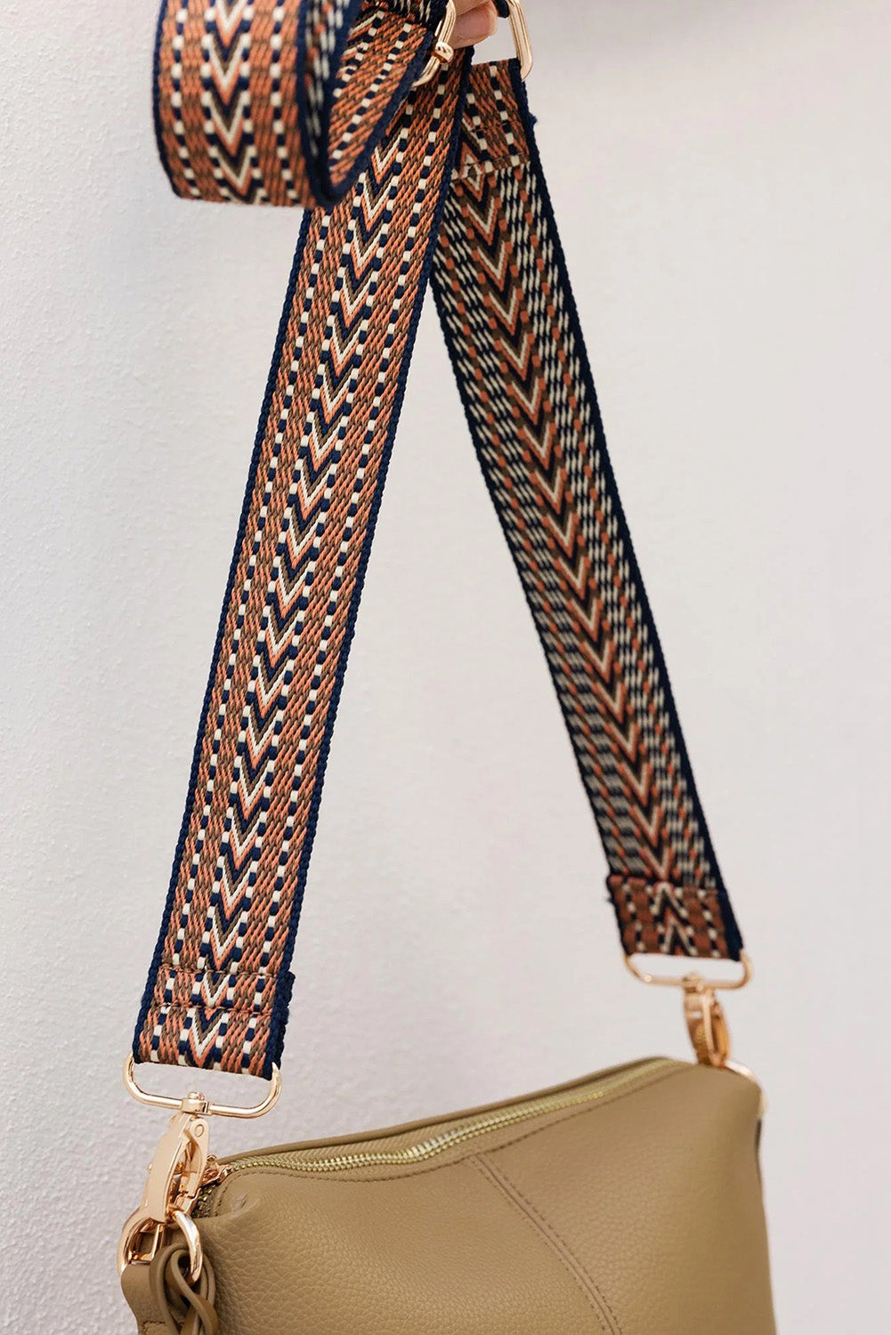 A model wearing the Kasey Crossbody Bag in colour Latte, from the front, showing the whole outfit