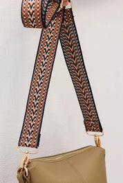 A model wearing the Kasey Crossbody Bag in colour Latte, from the front, showing the whole outfit