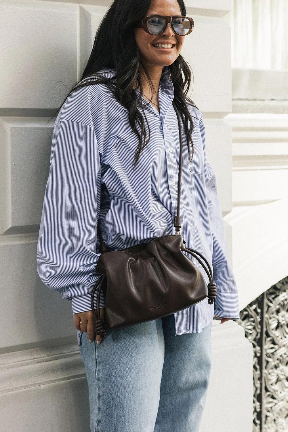 Product shot of the Yumi Crossbody Bag - Chocolate in colour Chocolate, from the back