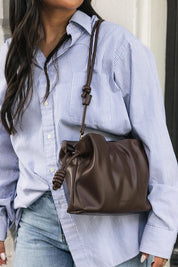 Product shot of the Yumi Crossbody Bag - Chocolate in colour Chocolate, showing detail