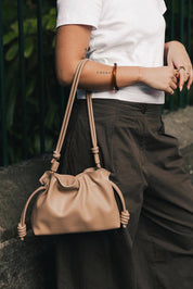 Product shot of the Yumi Crossbody Bag - Nude in colour Nude, from the back