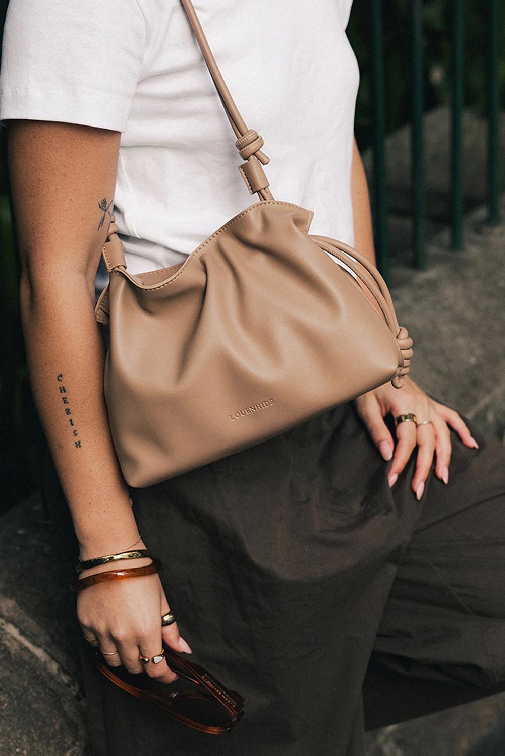 Product shot of the Yumi Crossbody Bag - Nude in colour Nude, showing detail