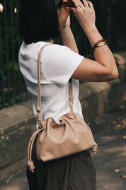 Product shot of the Yumi Crossbody Bag - Nude in colour Nude, from the front