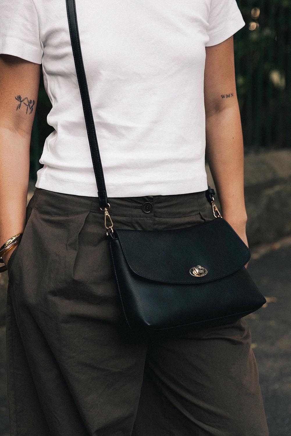 Product shot of the Nisha Shoulder Bag - Black in colour Black, from the back