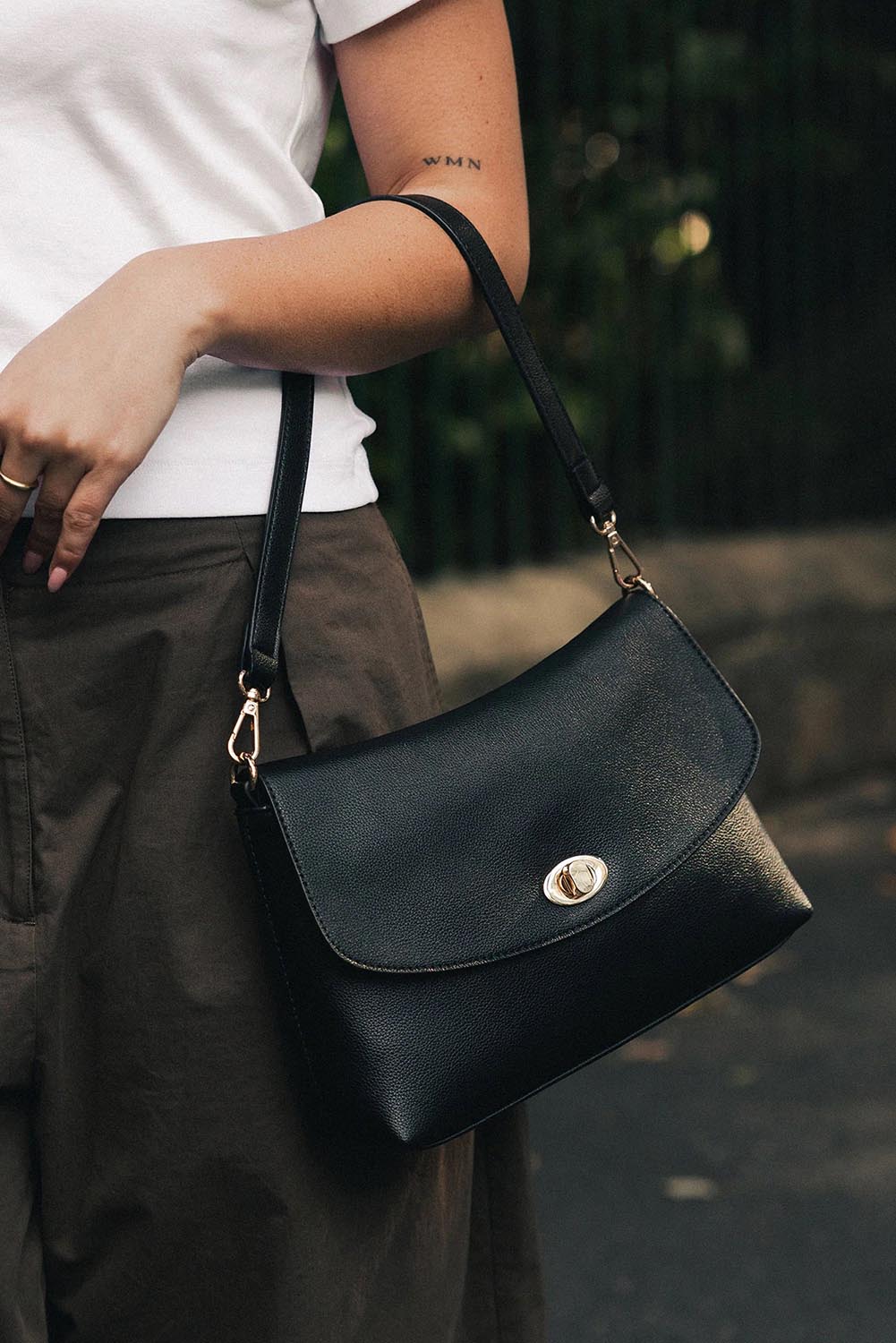 Product shot of the Nisha Shoulder Bag - Black in colour Black, from the front