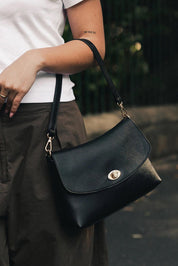 Product shot of the Nisha Shoulder Bag - Black in colour Black, from the front