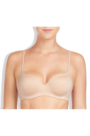 A model wearing the Sexy & Seamless Contour Bra in colour Nude, from the front, cropped image