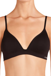 A model wearing the Simply Seamless Wirefree Bra in colour Black (Black), from the front, cropped image