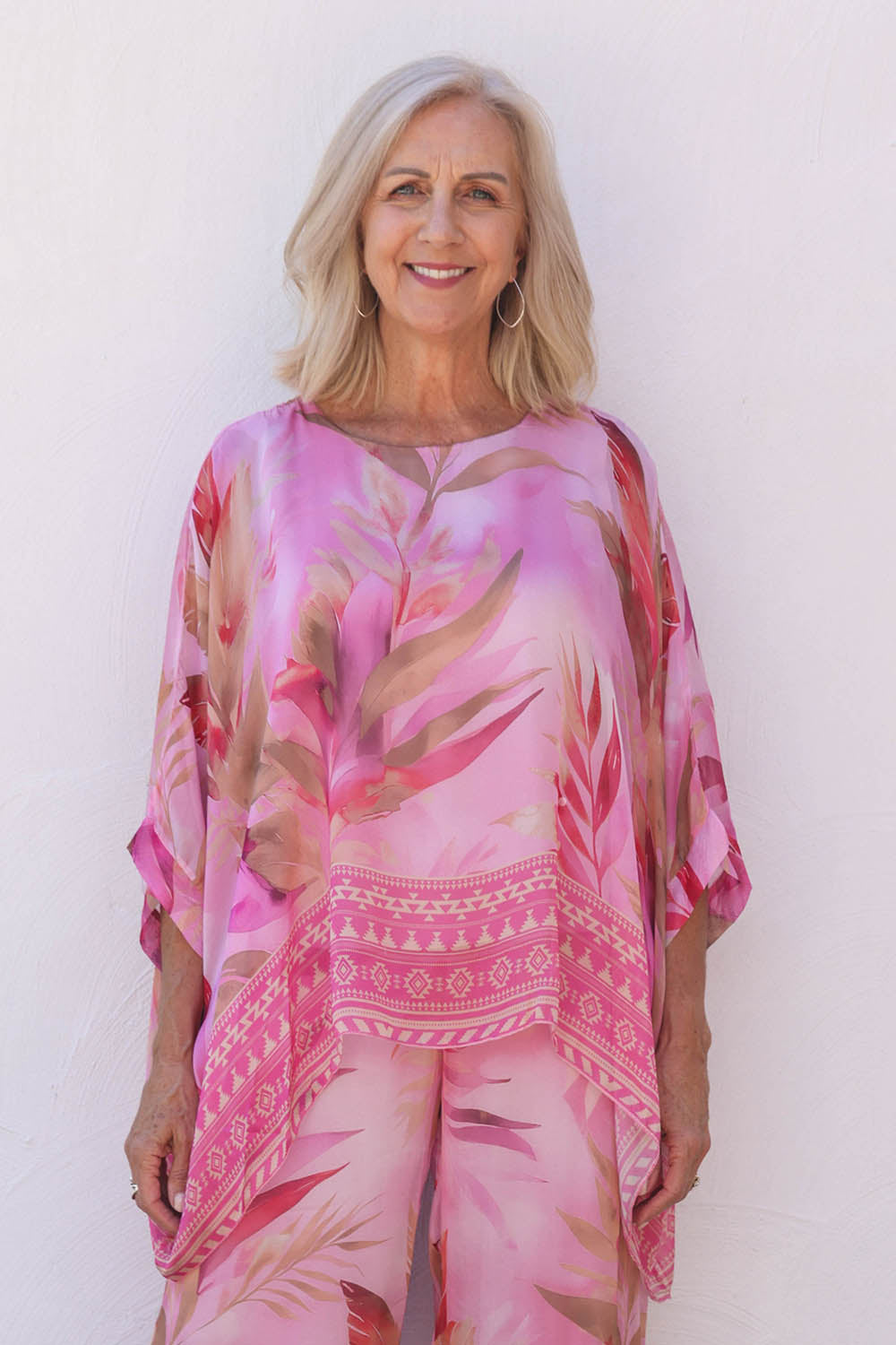Model Sandy wearing the Silk Blend Printed Kaftan Top in colour Pinkprint (Pink), from the front, cropped image