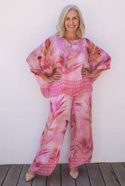 Model Sandy wearing the Silk Blend Printed Kaftan Top in colour Pinkprint (Pink), from the front, showing the whole outfit