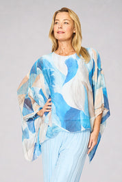Model Genericm wearing size sample of the Silk Blend Printed Kaftan Top - Celesteabstract in colour Celesteabstract, from an angle