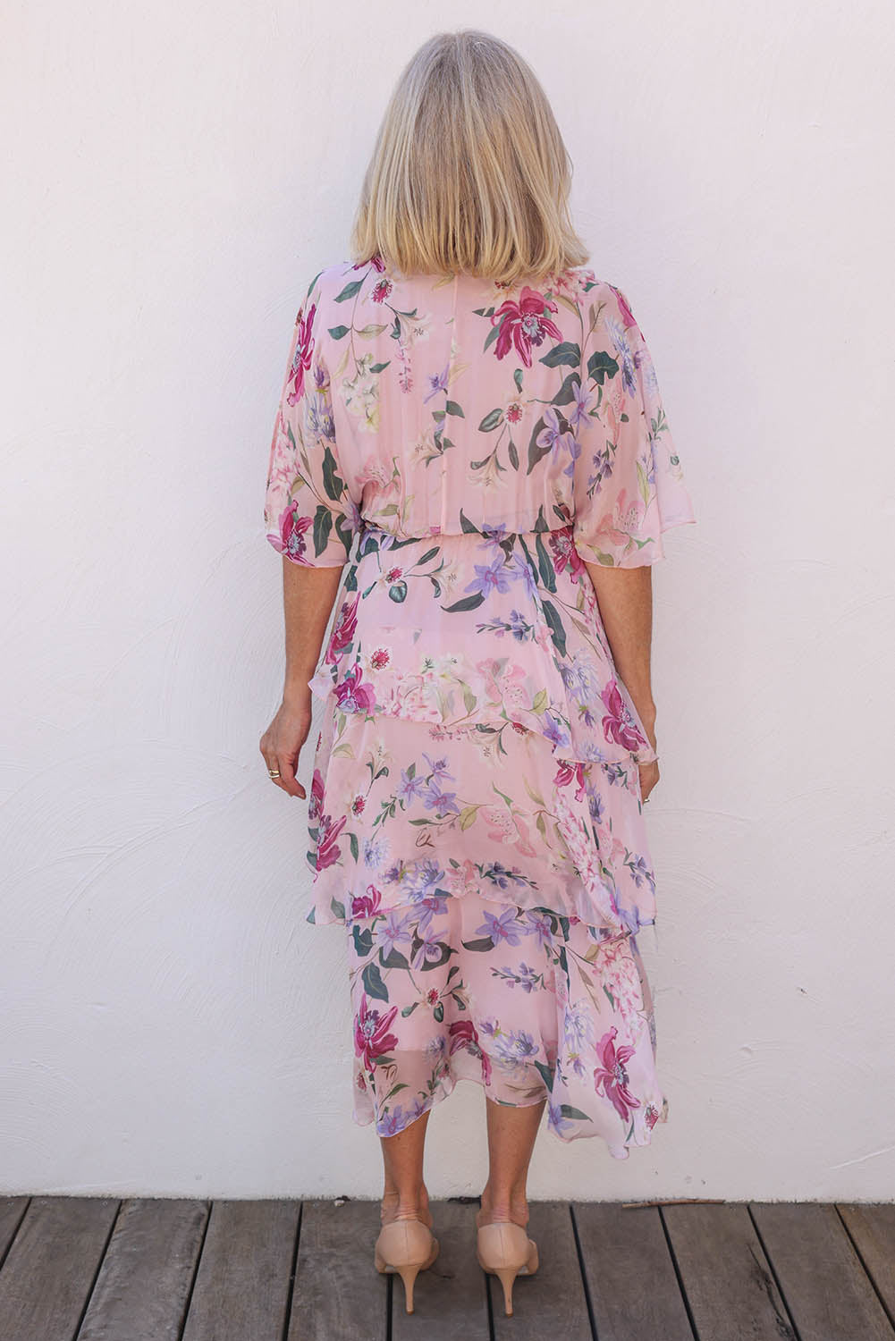 Model Sandy wearing the Short Sleeve Silk Blend Print Dress in colour Blushpink (Pink), from the back